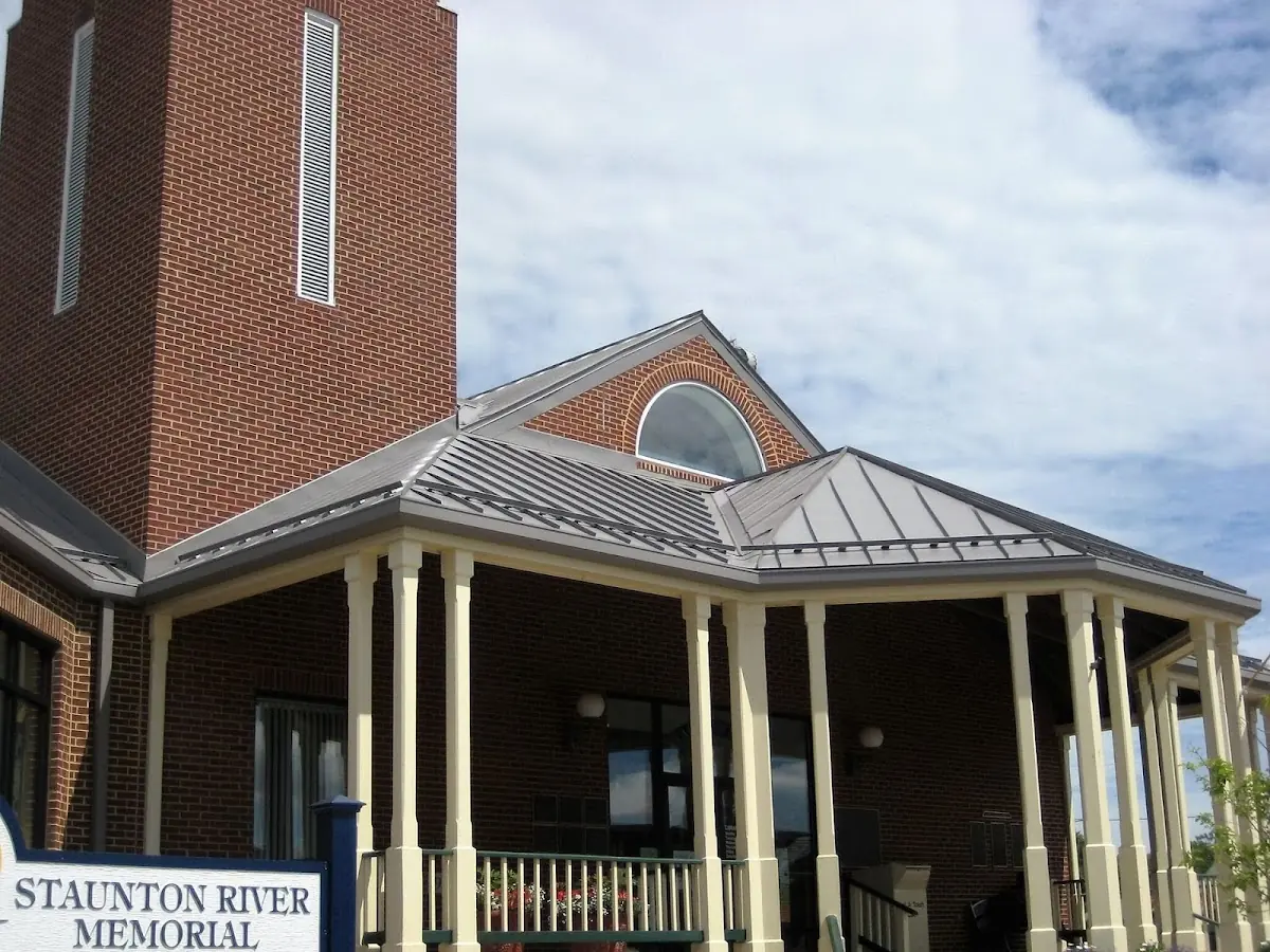 Skilled roofing craftsmen working on a residential roof in Muttontown